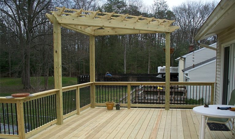 Pressure Treated Wood Deck and Wood Railing with Round Black Aluminum Balusters-Corner Pressure Treated Pergola