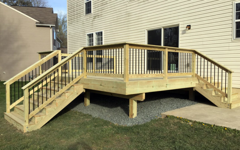 Types Pressure Treated Wood Decking and wood railing with aluminum balusters - deck has two sets of stairs