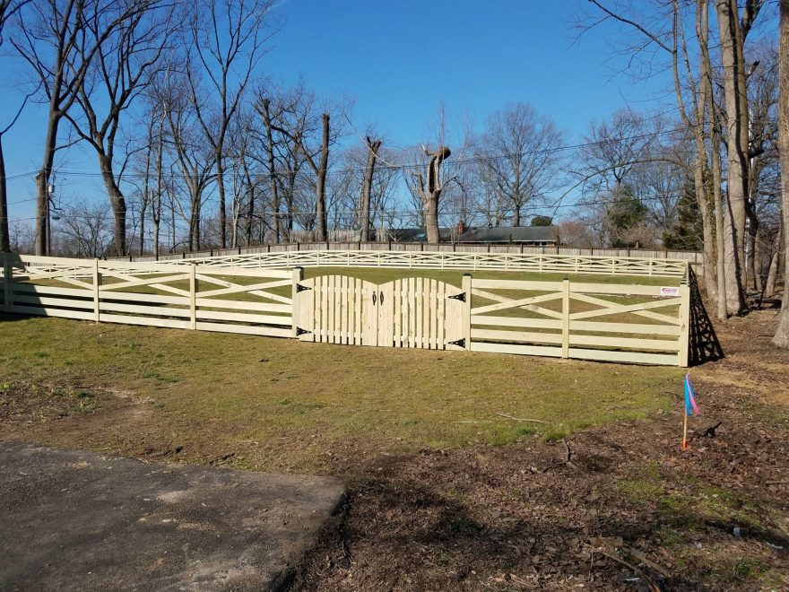 4 foot high pressure treated wood Crossbuck style fence with double arched gate