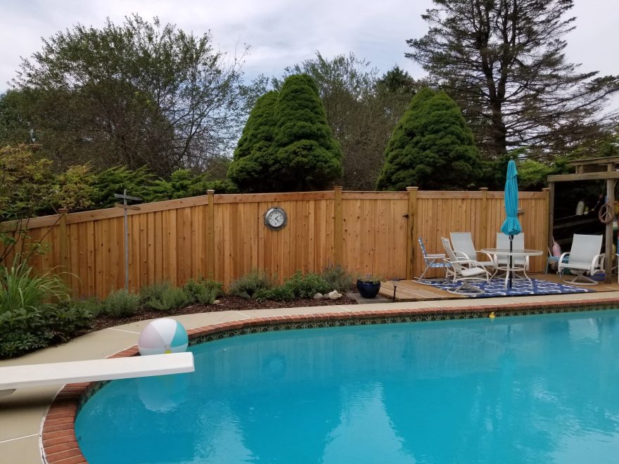 6 foot high Cedar Board and Batten Privacy Fence with Cedar Fascia on top + New England Post Caps